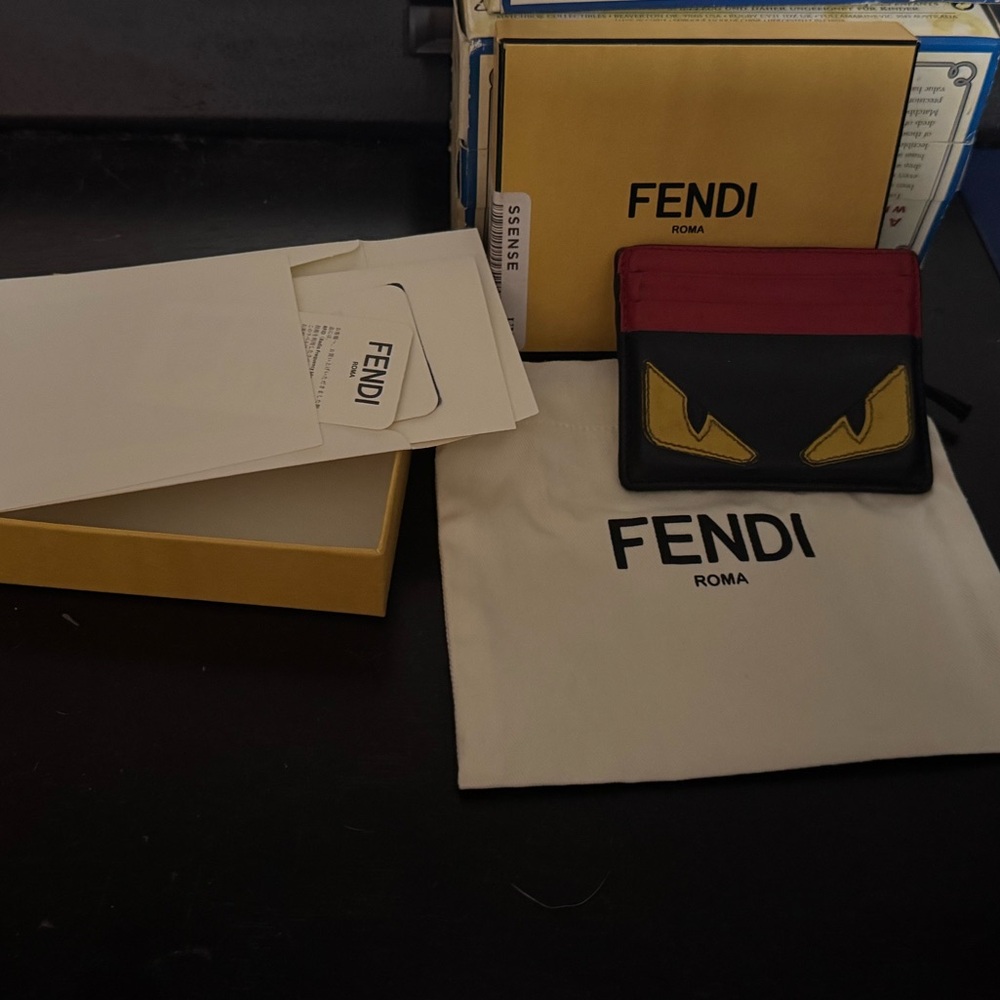 Authentic Fendi Men's Black and Red Monster Wallet with certificate of auth